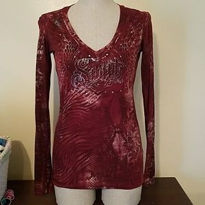 Sinful size small long sleeve, cut out back